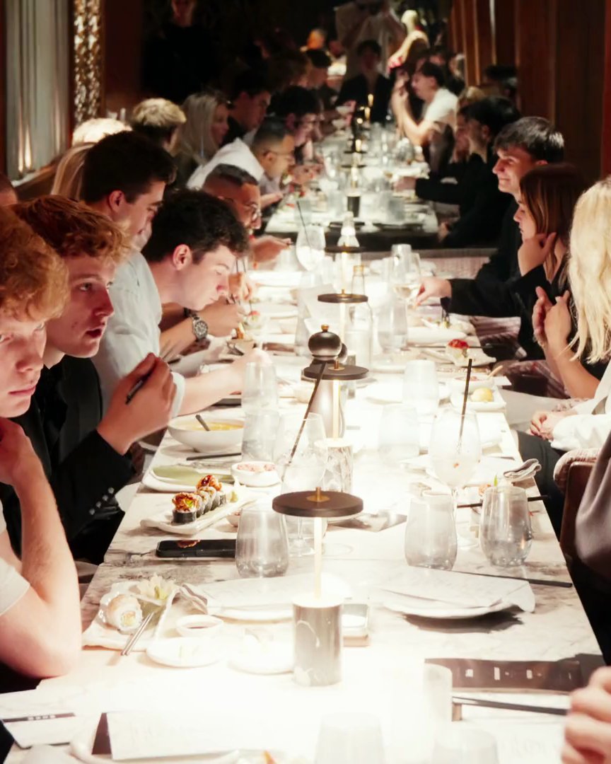 The long candlelit table at ShiYuzu, members seated along both sides